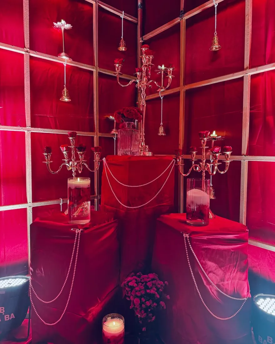 Vintage red velvet decor with candelabras and roses