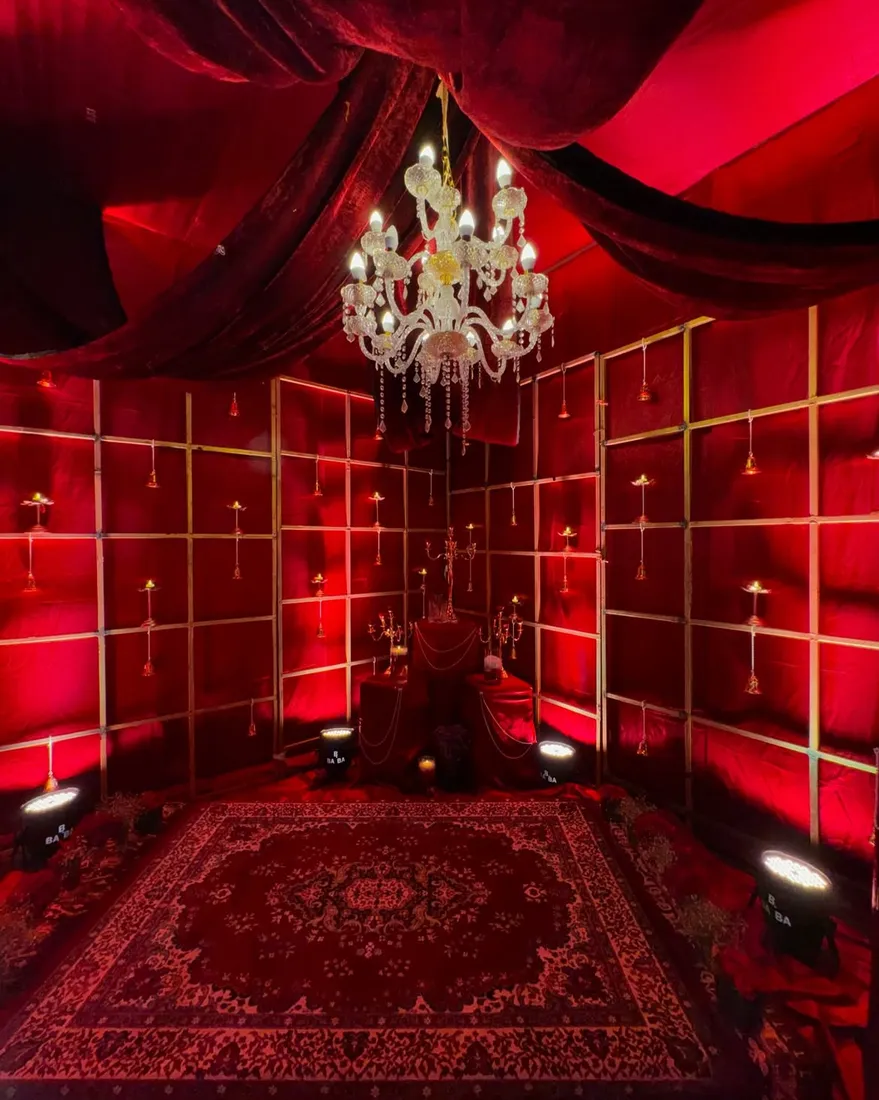 Vintage red velvet lounge with crystal chandelier