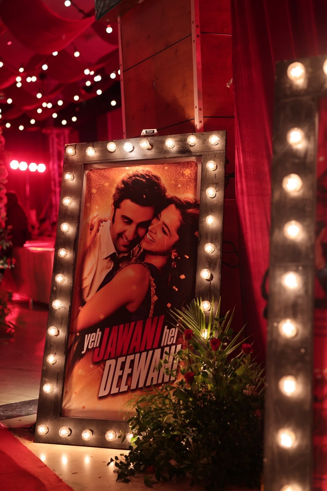 Vintage marquee-lit Bollywood poster styling detail